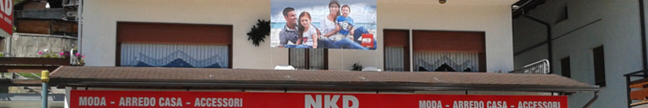 NKD VALLE DI CADORE - decorazione con adesivi ed insegna luminosa