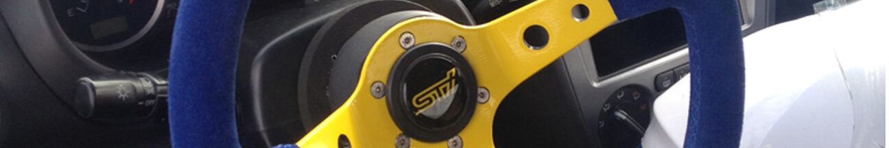 SUBARU IMPREZA WRX STI - rivestimento volante e logo Sti resinato